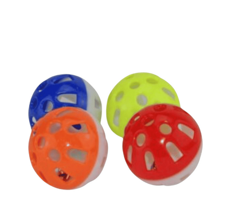 Four colorful plastic balls with holes on a white background