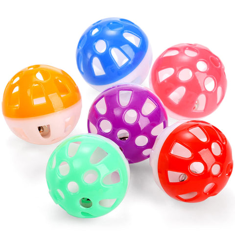 Colorful mushroom-shaped plastic balls on a white background