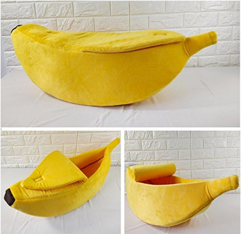 Yellow banana-shaped pet bed on a white background