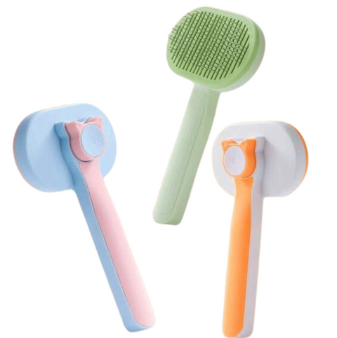 Three colorful cleaning brushes on a white background