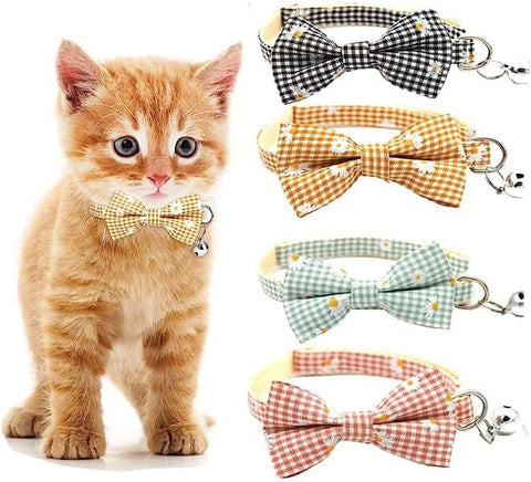 Cat wearing a yellow checkered bow tie with four additional bow ties displayed.