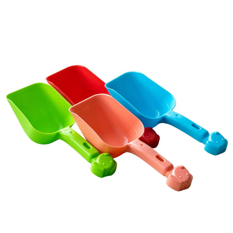Set of colorful plastic shovels on a white background
