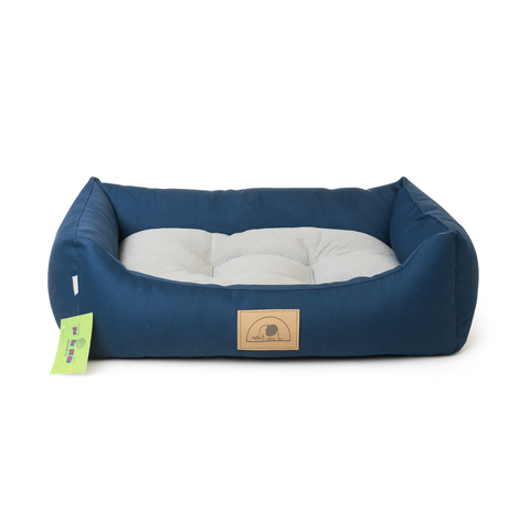 Navy blue pet bed with white cushion on a white background