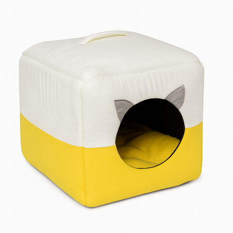 Cube-shaped pet bed with a white top and yellow bottom on a white background