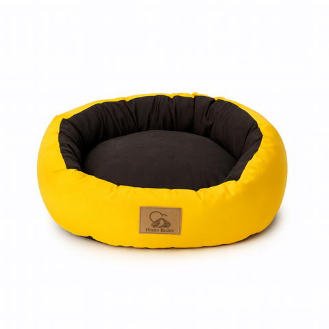 Yellow and black pet bed with a visible brand logo on a white background