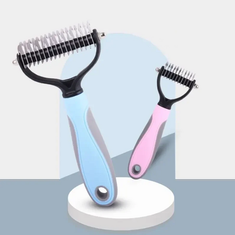 Two pet grooming tools, one blue and one pink, on a white stand with a light blue background.