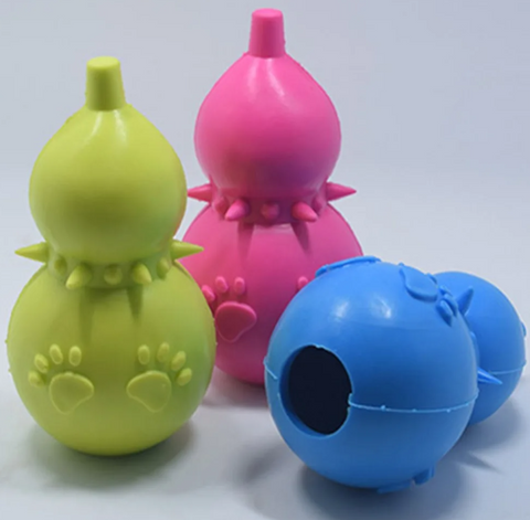 Three colorful dog toys on a white background