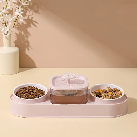 Pet feeding station with two bowls and a water dispenser on a beige surface.