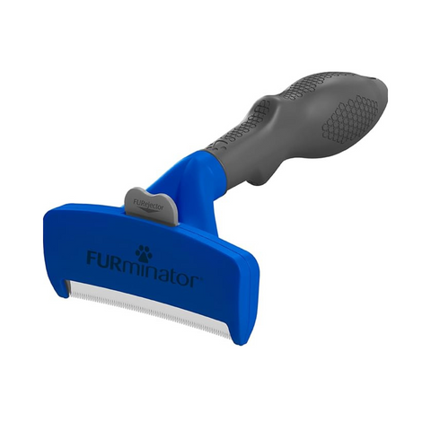 Blue and gray FURminator pet grooming tool on a white background