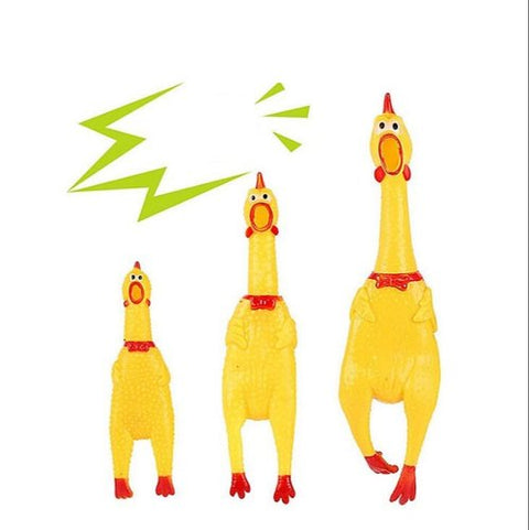 Three yellow rubber chicken toys with red accents on a white background