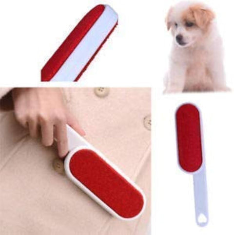 Pet grooming brush with red and white design, used on a coat and a dog.