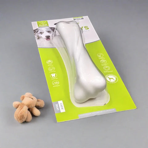 Dog bone-shaped toy with packaging on a gray background