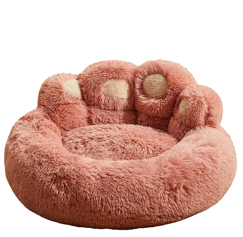 Pink paw-shaped pet bed on a white background