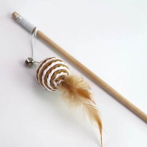 Cat toy with feather and wooden stick on a white background