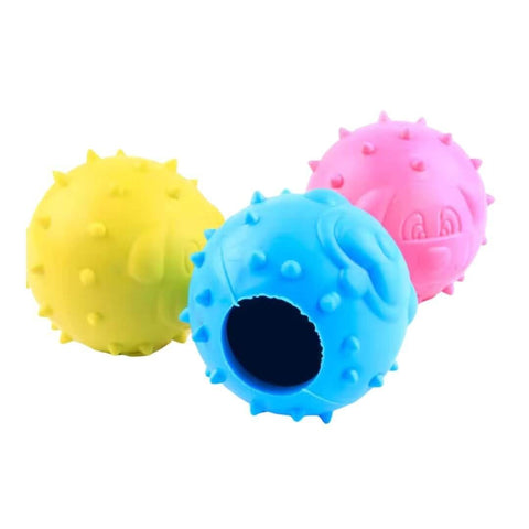 Three textured rubber balls in yellow, blue, and pink on a white background
