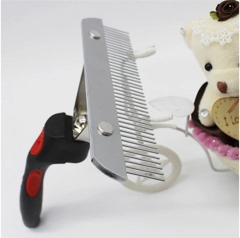 Pet grooming comb and clippers on a white background