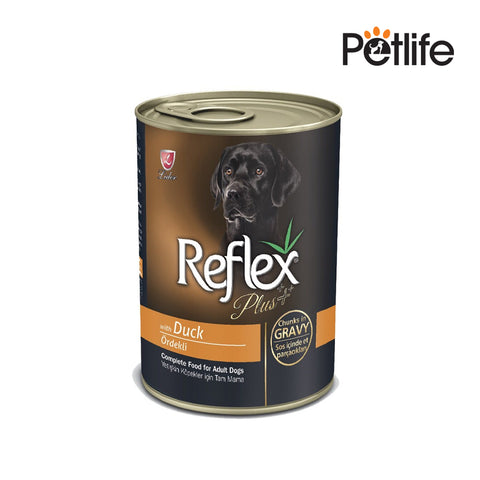 Can of Reflex Plus dog food with a black labrador on the label, on a white background.