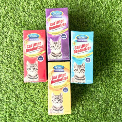 Four boxes of Remu Cat Litter Deodorizer on a grass background