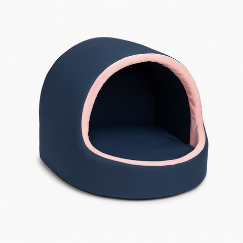 Navy blue pet bed with pink interior on a white background