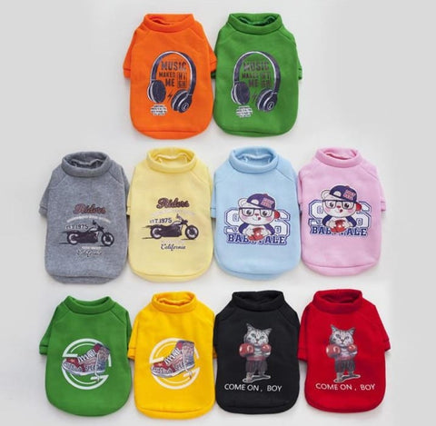 Collection of colorful pet shirts with various designs on a white background