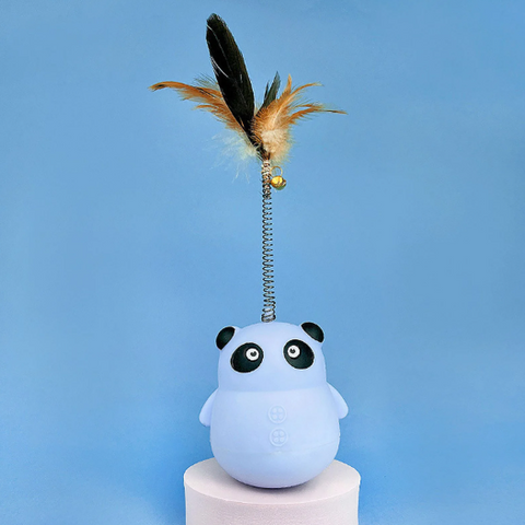 Panda-shaped toy with a feather and spring on a blue background