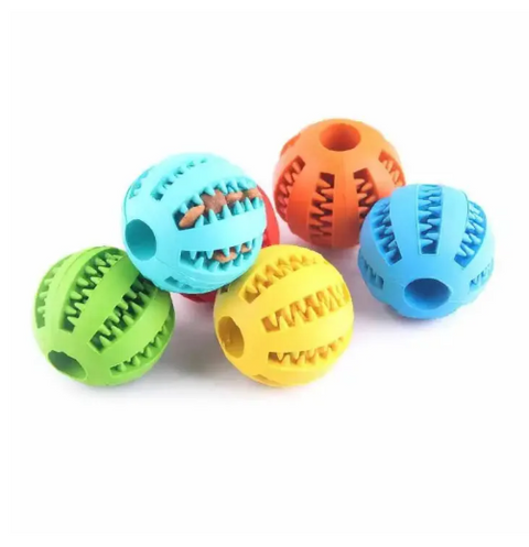Colorful dog toy balls with textured surfaces on a white background